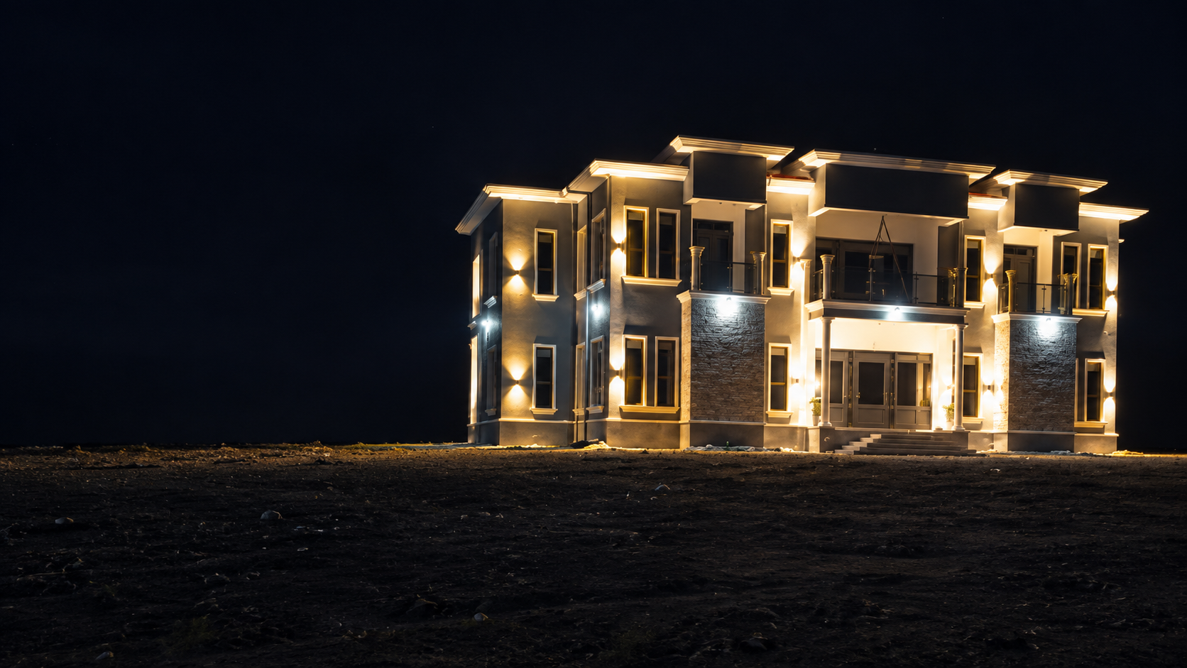 Completed home exterior lighting installation at night